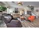 Relaxing living room showcases a fireplace, comfortable seating, and a staircase to the upper level at 10662 Bonchester Hill St, Las Vegas, NV 89141