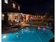 Backyard oasis featuring a sparkling pool, covered patio, and comfortable seating for outdoor relaxation at 10662 Bonchester Hill St, Las Vegas, NV 89141