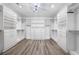 Walk-in closet with custom shelving and drawers offers optimal organization and storage space for clothes and accessories at 10748 Steel Ridge Ct, Las Vegas, NV 89135