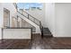 Modern living space featuring a staircase with metal railing and a stylish bar at 10748 Steel Ridge Ct, Las Vegas, NV 89135