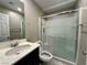 Bathroom featuring a shower, toilet, and a vanity sink with a light-colored countertop at 10941 Prudhoe Bay St, Las Vegas, NV 89179