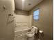 Bathroom with toilet and bath tub featuring tiled floors at 10941 Prudhoe Bay St, Las Vegas, NV 89179