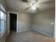 Bedroom featuring neutral paint, ceiling fan, carpeted floor and a window with natural light at 10941 Prudhoe Bay St, Las Vegas, NV 89179