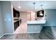 Modern kitchen featuring dark cabinetry, stainless steel appliances, granite countertops, and pendant lighting at 10941 Prudhoe Bay St, Las Vegas, NV 89179