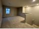 Living room with staircase featuring carpet and a window at 10941 Prudhoe Bay St, Las Vegas, NV 89179