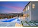 Backyard at twilight featuring a pool, built-in barbecue, outdoor lounge, and mountain backdrop at 11943 Rockview Point St, Las Vegas, NV 89138