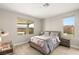 Cozy bedroom with natural light, a comfortable bed, and modern furnishings at 11943 Rockview Point St, Las Vegas, NV 89138