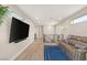 Bright hallway with a large TV, comfortable seating, and modern design elements at 11943 Rockview Point St, Las Vegas, NV 89138