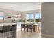 Eat in kitchen dining area, modern design with tiled flooring, stone countertop, and a view to backyard pool at 11943 Rockview Point St, Las Vegas, NV 89138