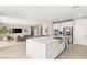 Open concept living space combining the kitchen and living room for seamless entertaining and relaxation at 11943 Rockview Point St, Las Vegas, NV 89138