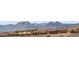 A row of houses showing rooftops, set against a mountain backdrop at 11943 Rockview Point St, Las Vegas, NV 89138