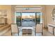 Bright living area showcasing patio views through large sliding glass doors and stylish neutral decor at 12 Wade Hampton Trl, Henderson, NV 89052