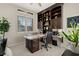 Well-lit home office featuring custom built-ins, granite desk and carpeted floors at 12 Wade Hampton Trl, Henderson, NV 89052