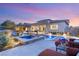 Inviting backyard with a sparkling pool, spa, and covered patio, perfect for outdoor entertaining and relaxation at 12 Wade Hampton Trl, Henderson, NV 89052