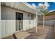 Enclosed backyard space with a rock landscape featuring a covered patio at 1299 Brenalee Ave, Henderson, NV 89002