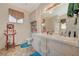 Bathroom featuring a double sink vanity, and well-lit mirror at 1299 Brenalee Ave, Henderson, NV 89002