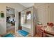 Full bathroom with bathtub and a view into the bedroom at 1299 Brenalee Ave, Henderson, NV 89002