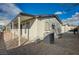 Home exterior featuring a gravel yard, covered patio and blue skies at 1299 Brenalee Ave, Henderson, NV 89002