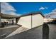 Home exterior featuring a gravel yard, covered patio and blue skies at 1299 Brenalee Ave, Henderson, NV 89002