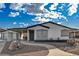 Charming single-story home with covered entry, desert landscaping, and a detached garage at 1299 Brenalee Ave, Henderson, NV 89002