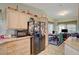 This eat-in kitchen features granite countertops and black appliances at 1299 Brenalee Ave, Henderson, NV 89002