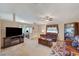 Open-concept living room featuring a fireplace and media center at 1299 Brenalee Ave, Henderson, NV 89002