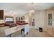 A lovely living room with carpet and a chandelier at 1299 Brenalee Ave, Henderson, NV 89002