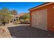 Landscaped backyard with desert landscaping and covered patio area at 1455 Waterfall Ln, Mesquite, NV 89034