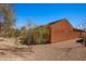 Back exterior view of a home with desert landscaping at 1455 Waterfall Ln, Mesquite, NV 89034