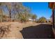 Spacious backyard area with desert landscaping and fencing at 1455 Waterfall Ln, Mesquite, NV 89034