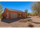 Back of house, showing patio and desert-style backyard landscaping at 1455 Waterfall Ln, Mesquite, NV 89034