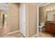 View of the half bath featuring a toilet and vanity with dark wood cabinetry at 1455 Waterfall Ln, Mesquite, NV 89034