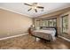 Cozy bedroom with natural light, ceiling fan, and neutral decor at 1455 Waterfall Ln, Mesquite, NV 89034