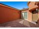 View of entry courtyard and sliding glass doors at 1455 Waterfall Ln, Mesquite, NV 89034