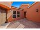 Entry courtyard with brick pavers, and stucco exterior at 1455 Waterfall Ln, Mesquite, NV 89034