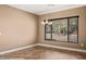 Bright dining room with a decorative light fixture and a large window with beautiful backyard view at 1455 Waterfall Ln, Mesquite, NV 89034