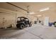 Spacious garage with high ceilings featuring an off-road vehicle at 1455 Waterfall Ln, Mesquite, NV 89034