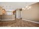 Bright, open-concept kitchen and dining area with tile flooring and pendant lighting at 1455 Waterfall Ln, Mesquite, NV 89034