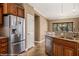 Kitchen with stainless steel appliances, granite countertops, and wood cabinetry at 1455 Waterfall Ln, Mesquite, NV 89034