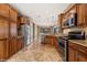 Spacious kitchen with stainless steel appliances and plenty of wood cabinet storage at 1455 Waterfall Ln, Mesquite, NV 89034