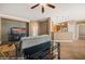 Spacious open-concept living area with a modern media center and partial view of the kitchen at 1455 Waterfall Ln, Mesquite, NV 89034