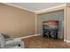 Cozy living room with modern media center and tile floor that complements the natural colors at 1455 Waterfall Ln, Mesquite, NV 89034