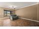 Cozy living room with tile flooring, ceiling fan, and large window overlooking the yard at 1455 Waterfall Ln, Mesquite, NV 89034