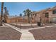 Gated community pool area with desert landscaping and surrounding buildings at 1830 N Pecos Rd # 137, Las Vegas, NV 89115