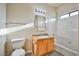 Bathroom featuring a vanity, mirror with light fixture, toilet, and tiled shower-tub combo at 2131 Hussium Hills St # 104, Las Vegas, NV 89108