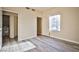 Bedroom with two doorways and large windows that let in natural light, complementing the light interior at 2131 Hussium Hills St # 104, Las Vegas, NV 89108