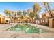 A serene swimming pool area with lush trees and well-maintained facilities at 2131 Hussium Hills St # 104, Las Vegas, NV 89108