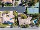 Aerial view showcasing the home's tile roof, pool, tennis court, and cul-de-sac location at 2285 Villefort Ct, Las Vegas, NV 89117