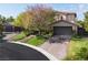 Elegant two-story home with a three-car garage and a meticulously landscaped front yard at 2285 Villefort Ct, Las Vegas, NV 89117