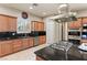 Modern kitchen featuring granite countertops, stainless steel appliances, and a spacious island with a gas cooktop at 2285 Villefort Ct, Las Vegas, NV 89117